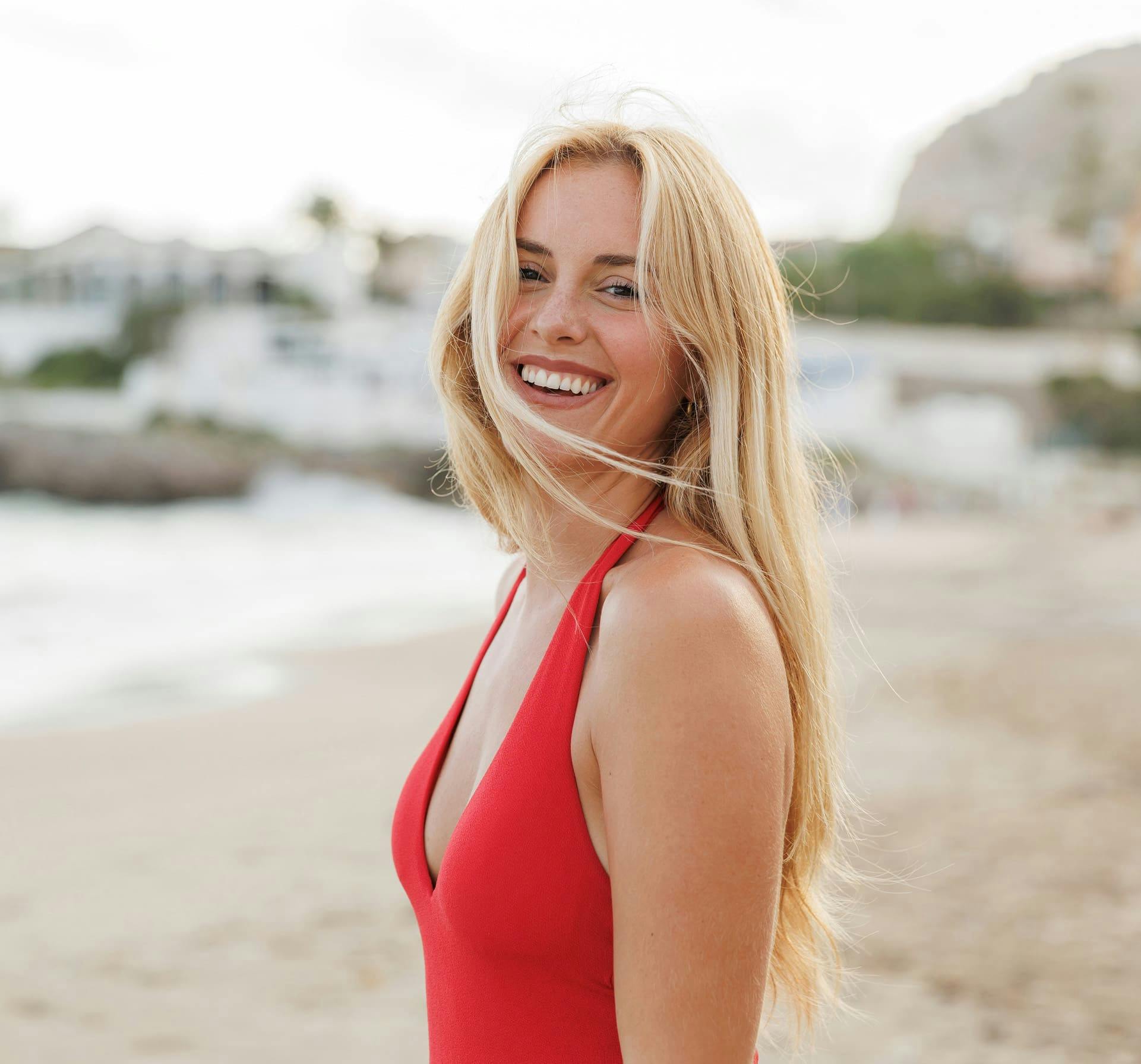 Woman on the beach smiling