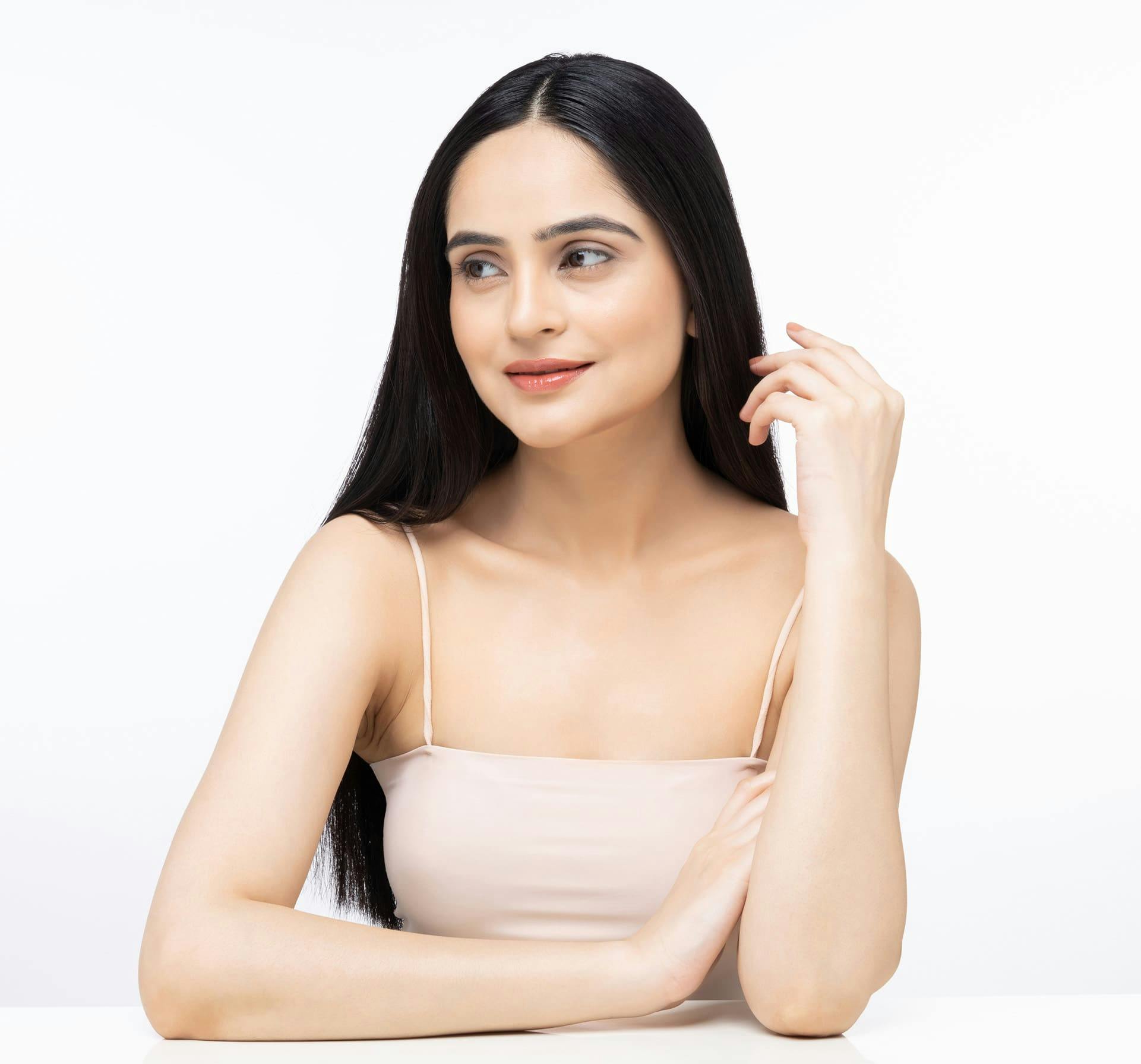 Woman with elbows on the table smiling