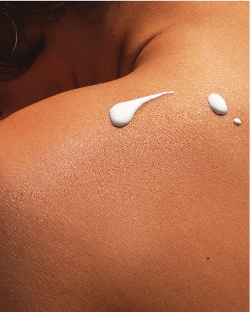 sunscreen on a person's shoulder