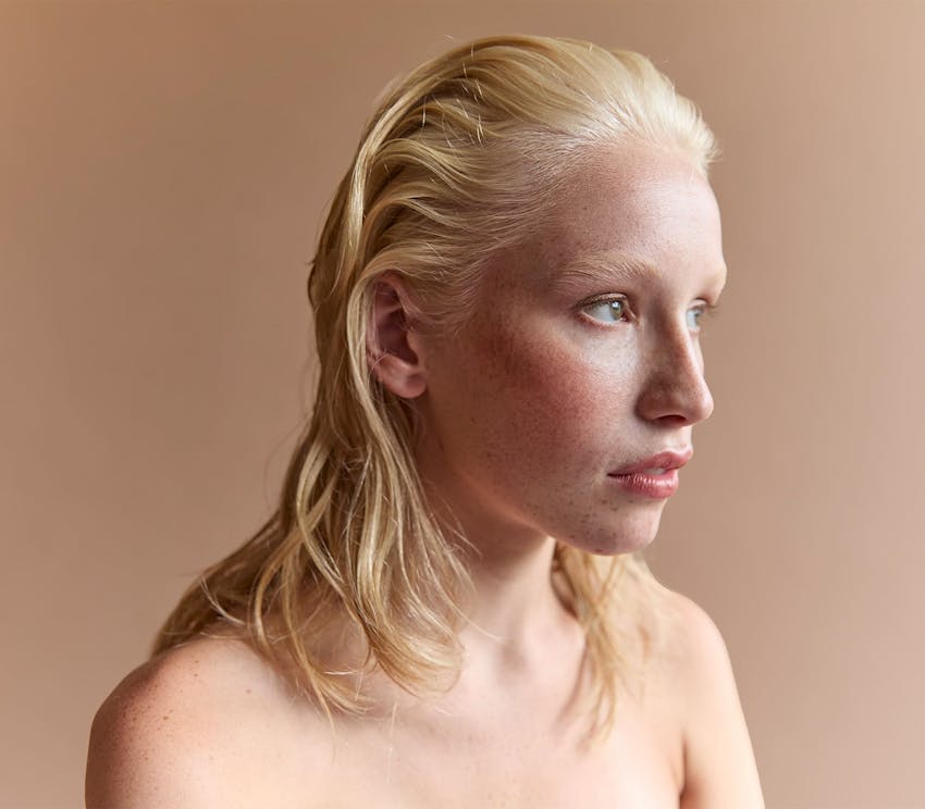 woman with blonde hair in a slickback