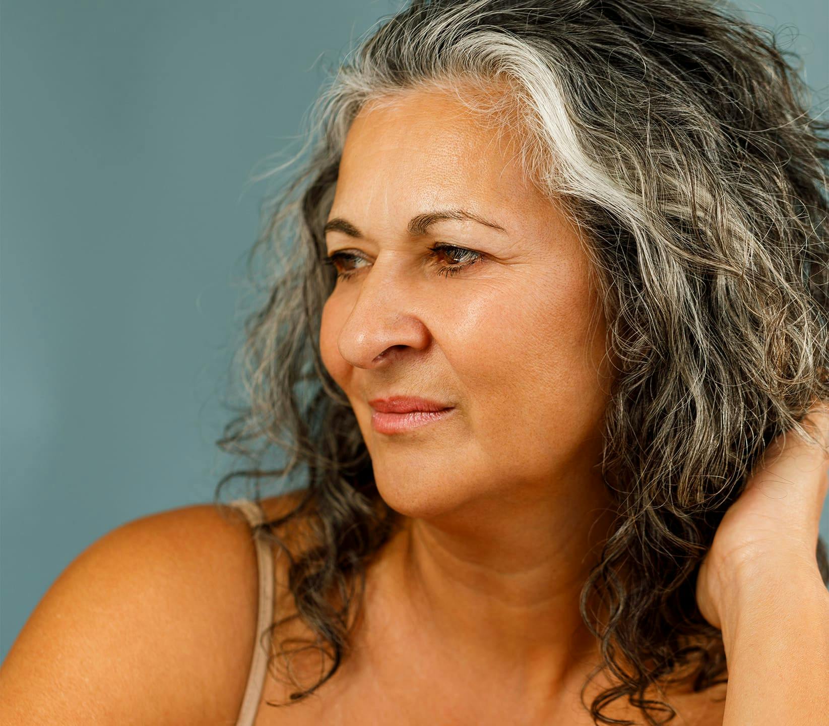 woman with gray hair looking to the left