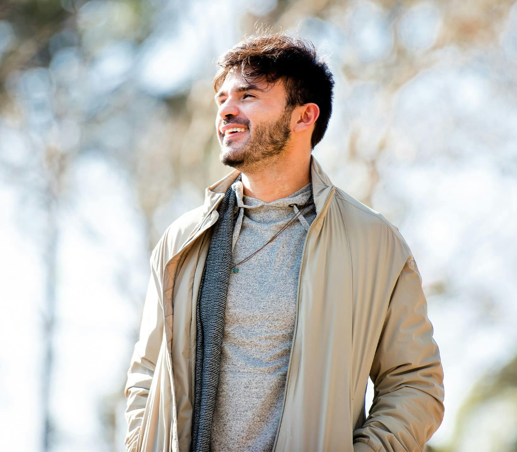 man outdoors smiling