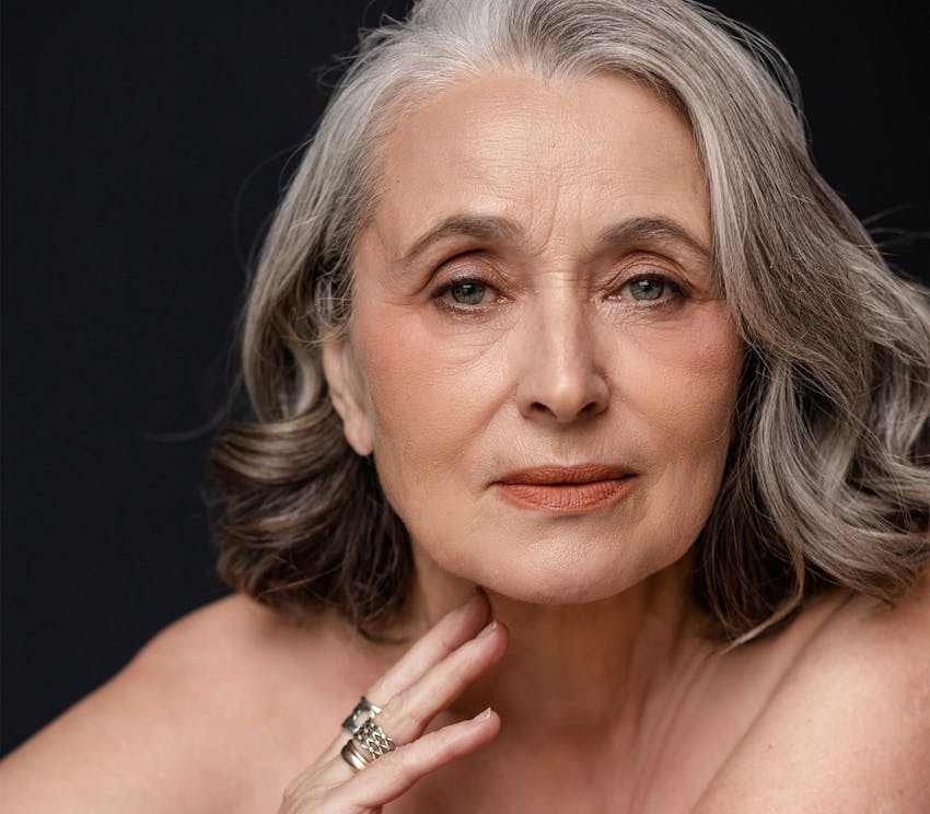 woman with gray hair looking forward