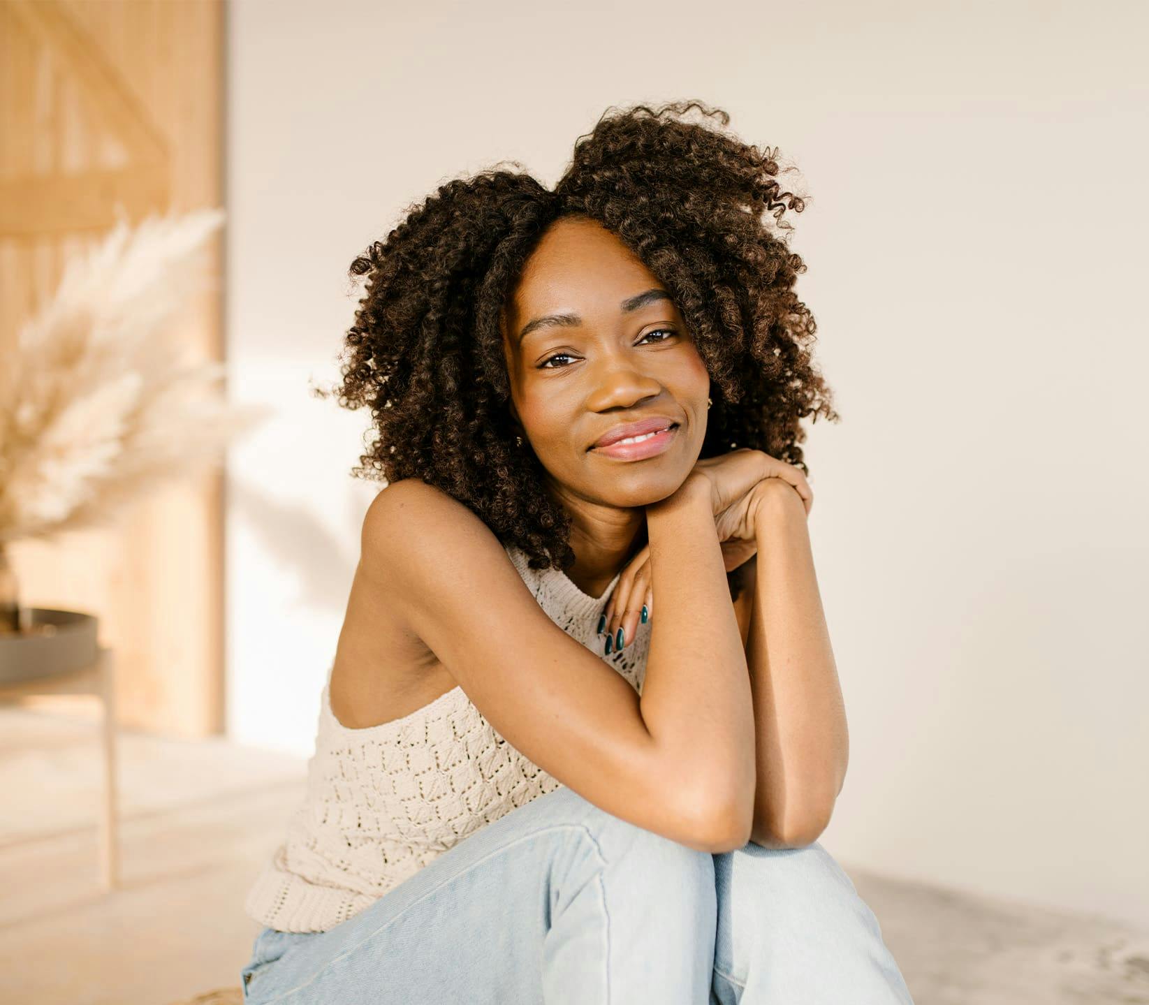 Woman sitting resting chin on hands