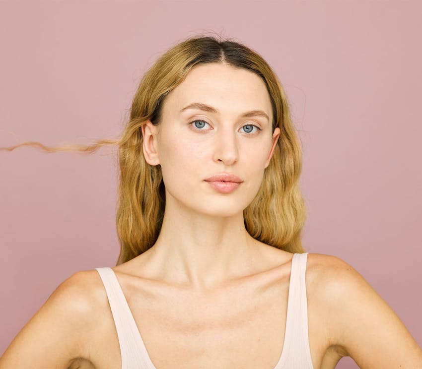 woman with dirty blonde hair looking forward
