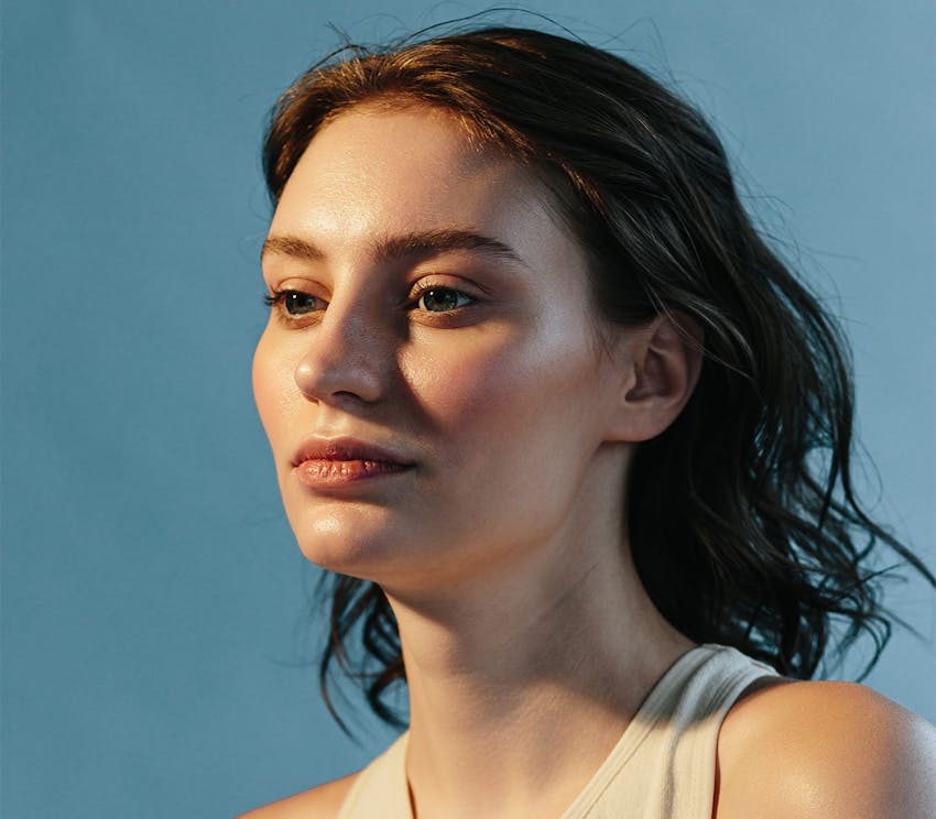 Woman against blue backdrop