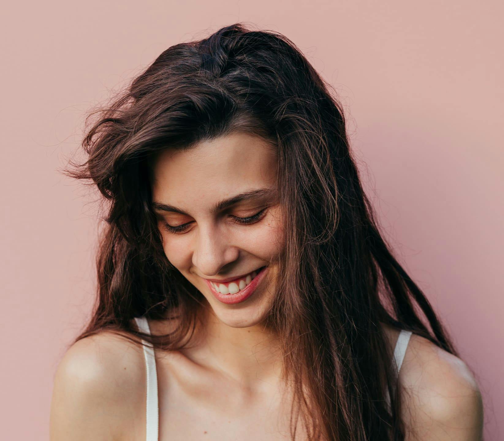 Woman looking down smiling