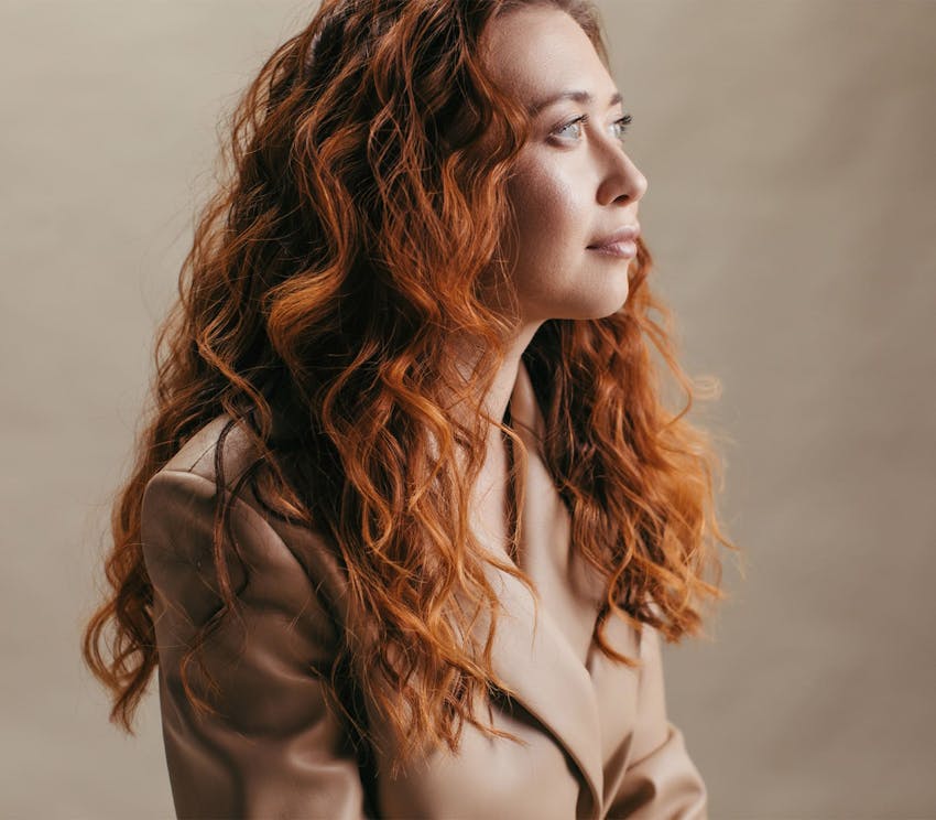 Red haired woman looking of to the side