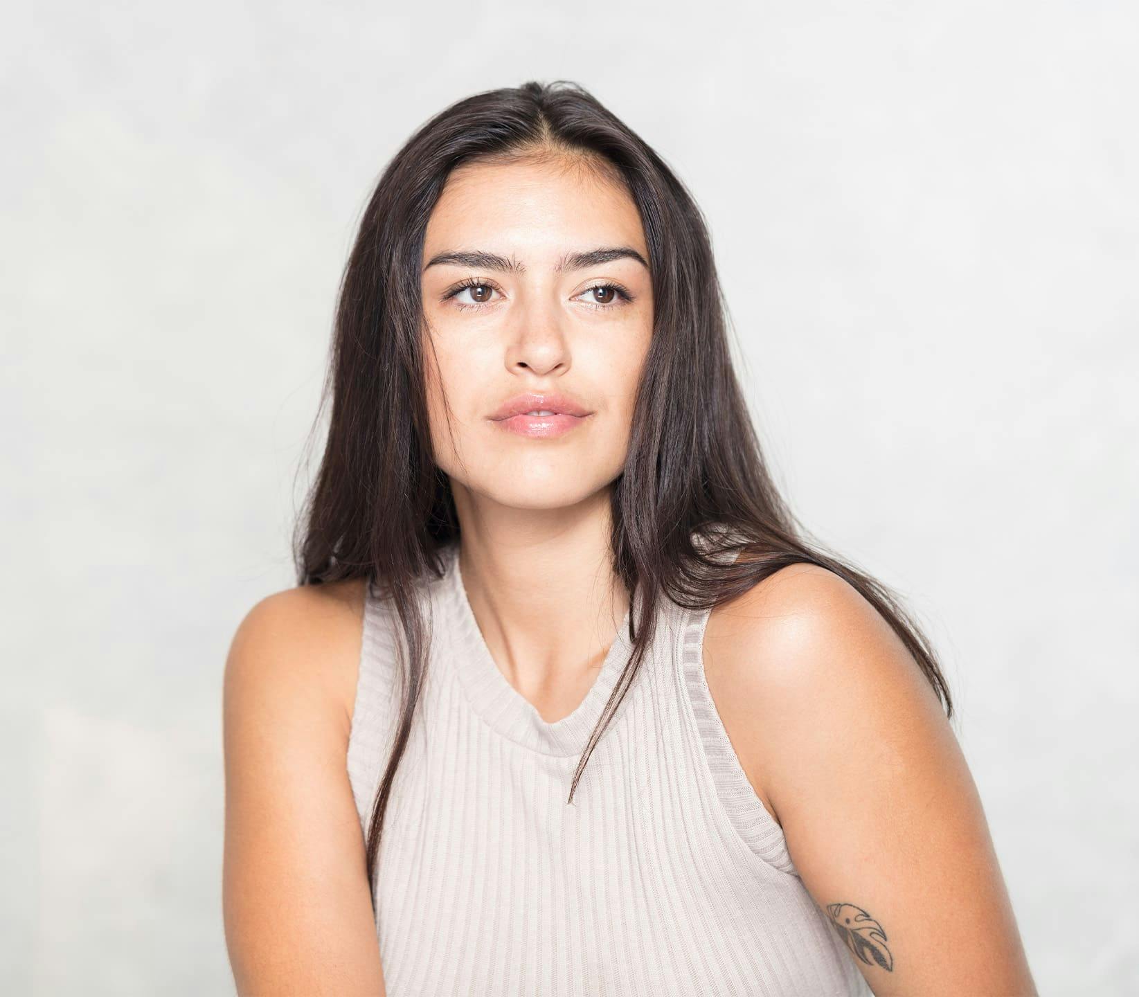 woman with straight hair looking forward