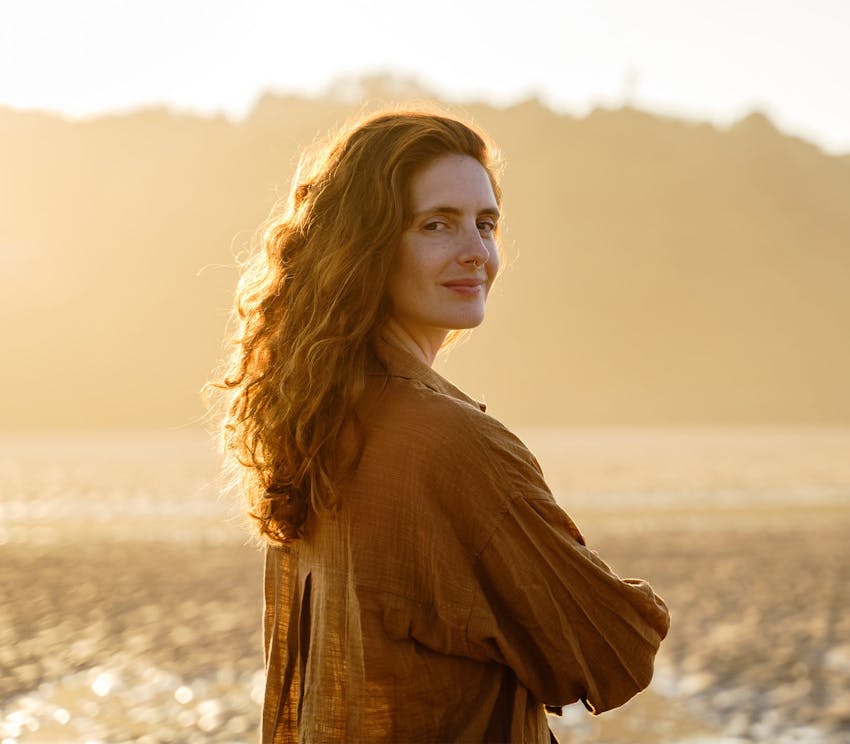 woman outside looking over her shoulder