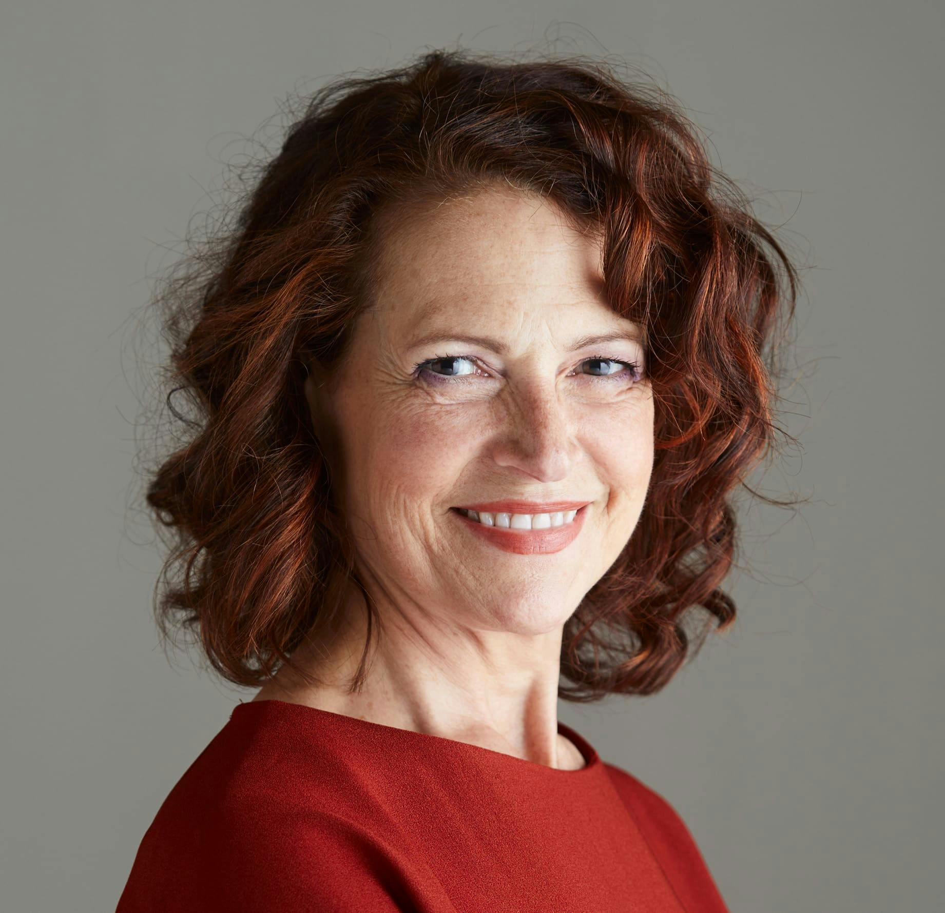 older woman with short red hair