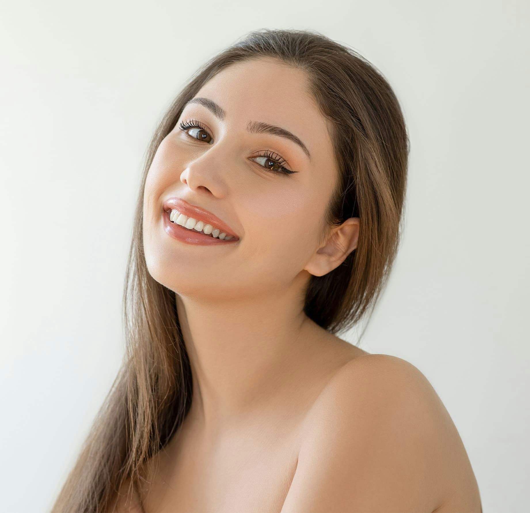 woman smiling and slightly leaning her head back