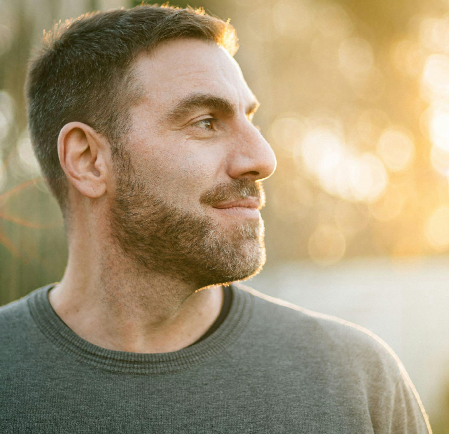 man looking to the right showing his side profile