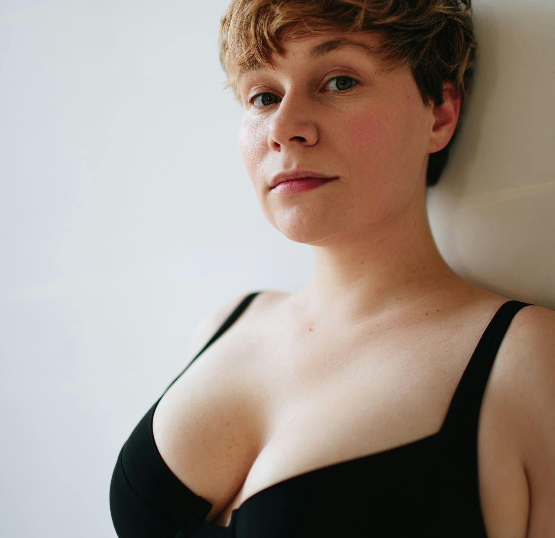 Woman leaning against wall