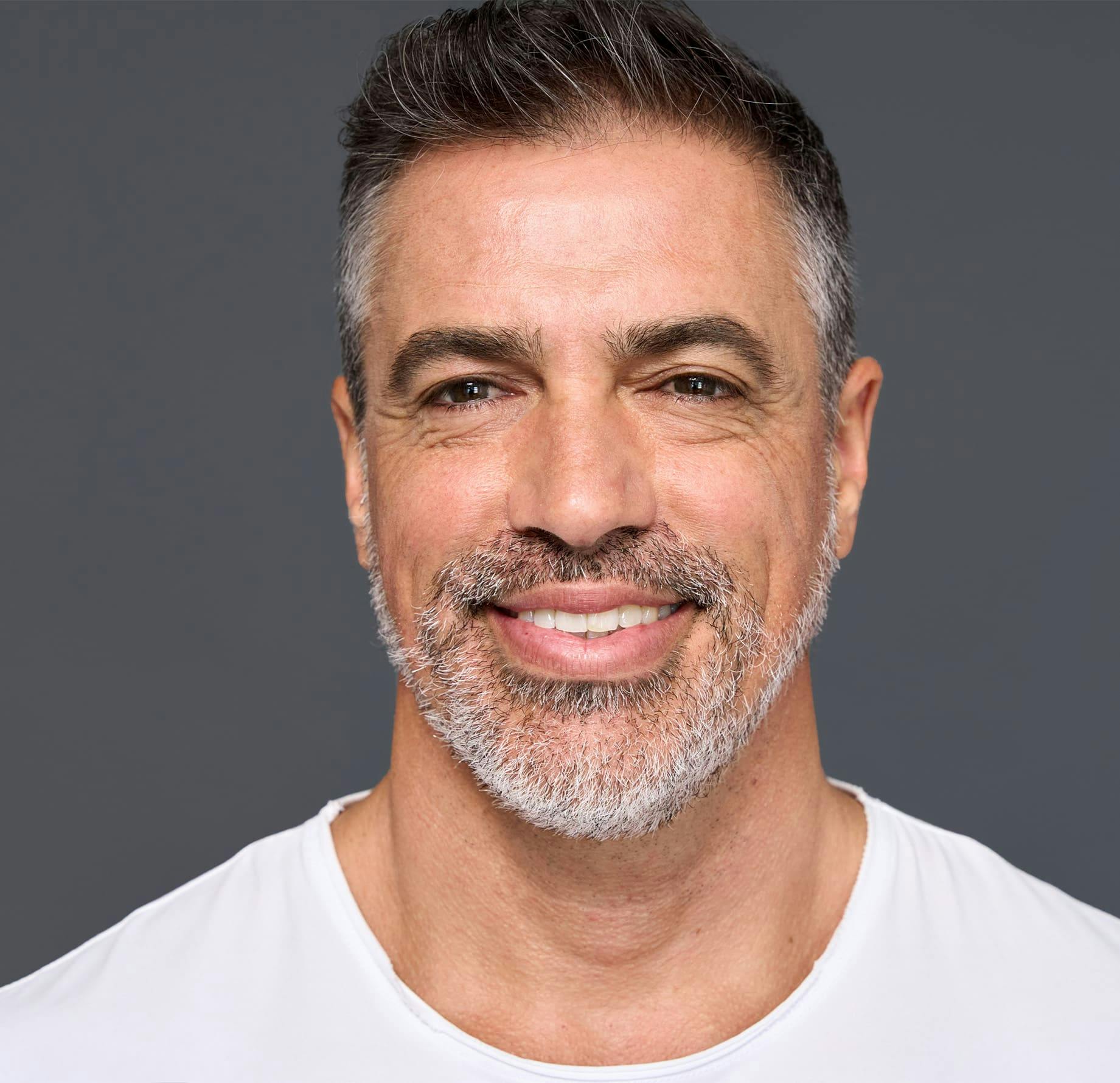 man looking forward and smiling