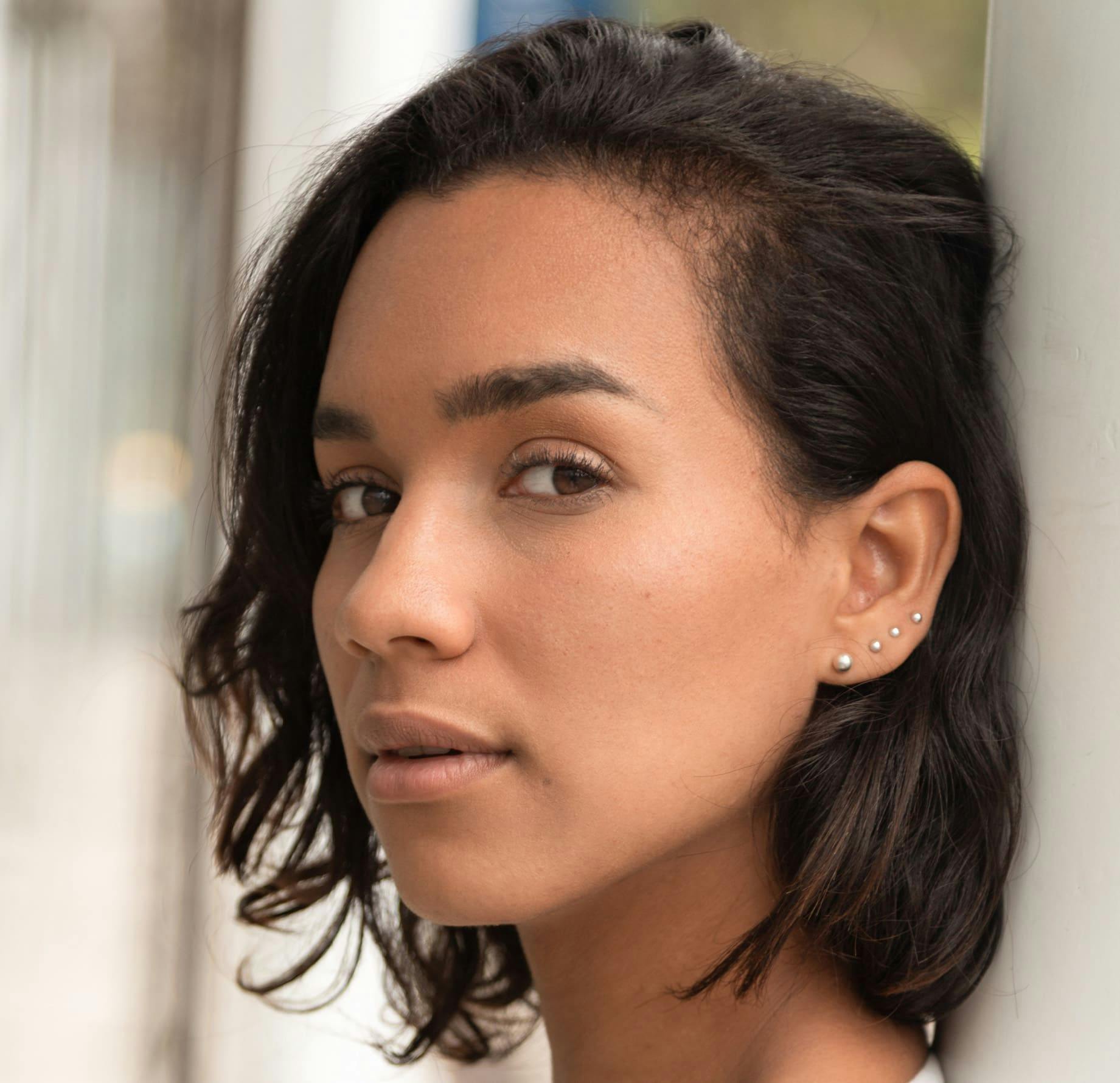 Woman leaning head on wall