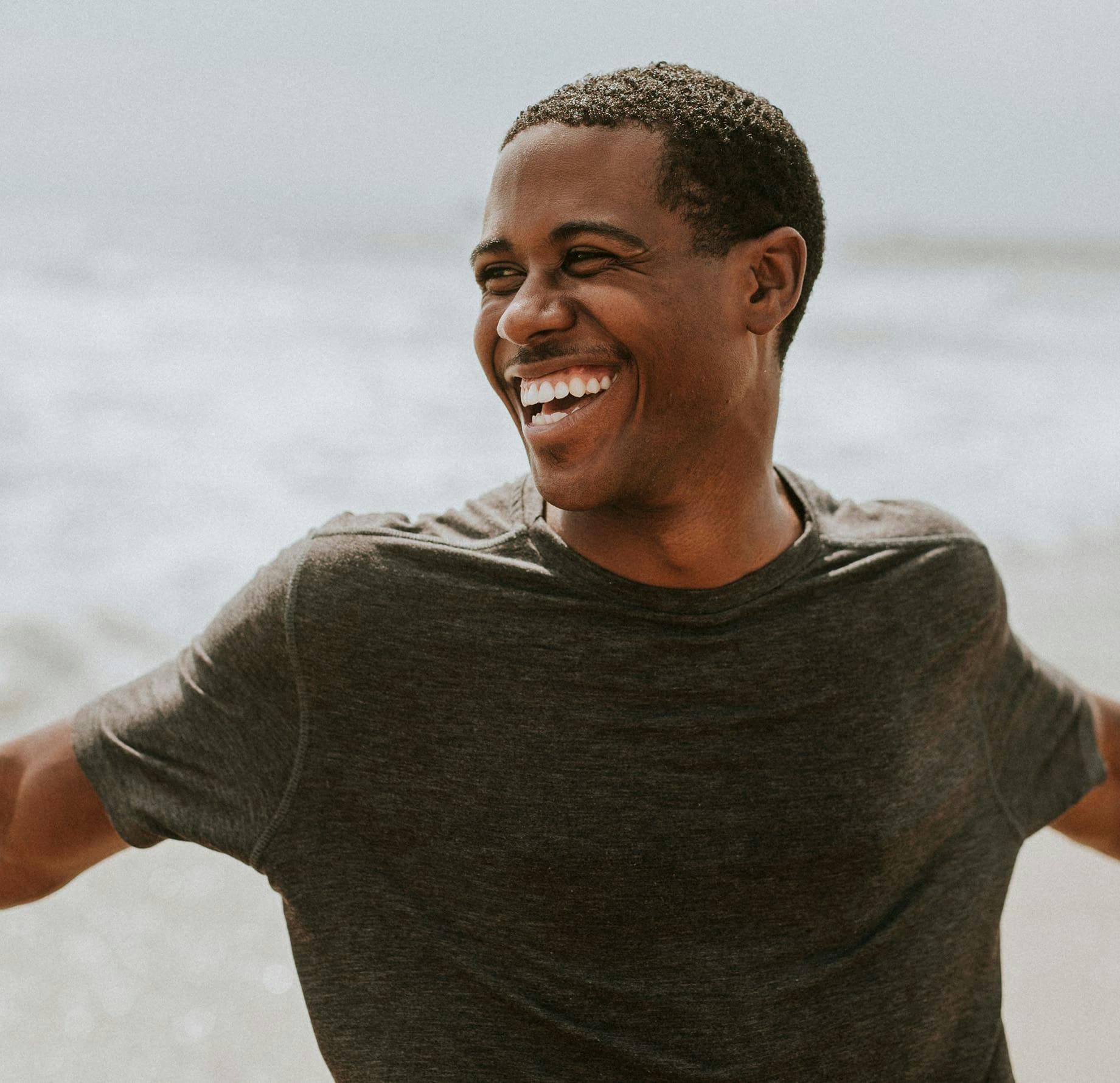 man outdoors smiling