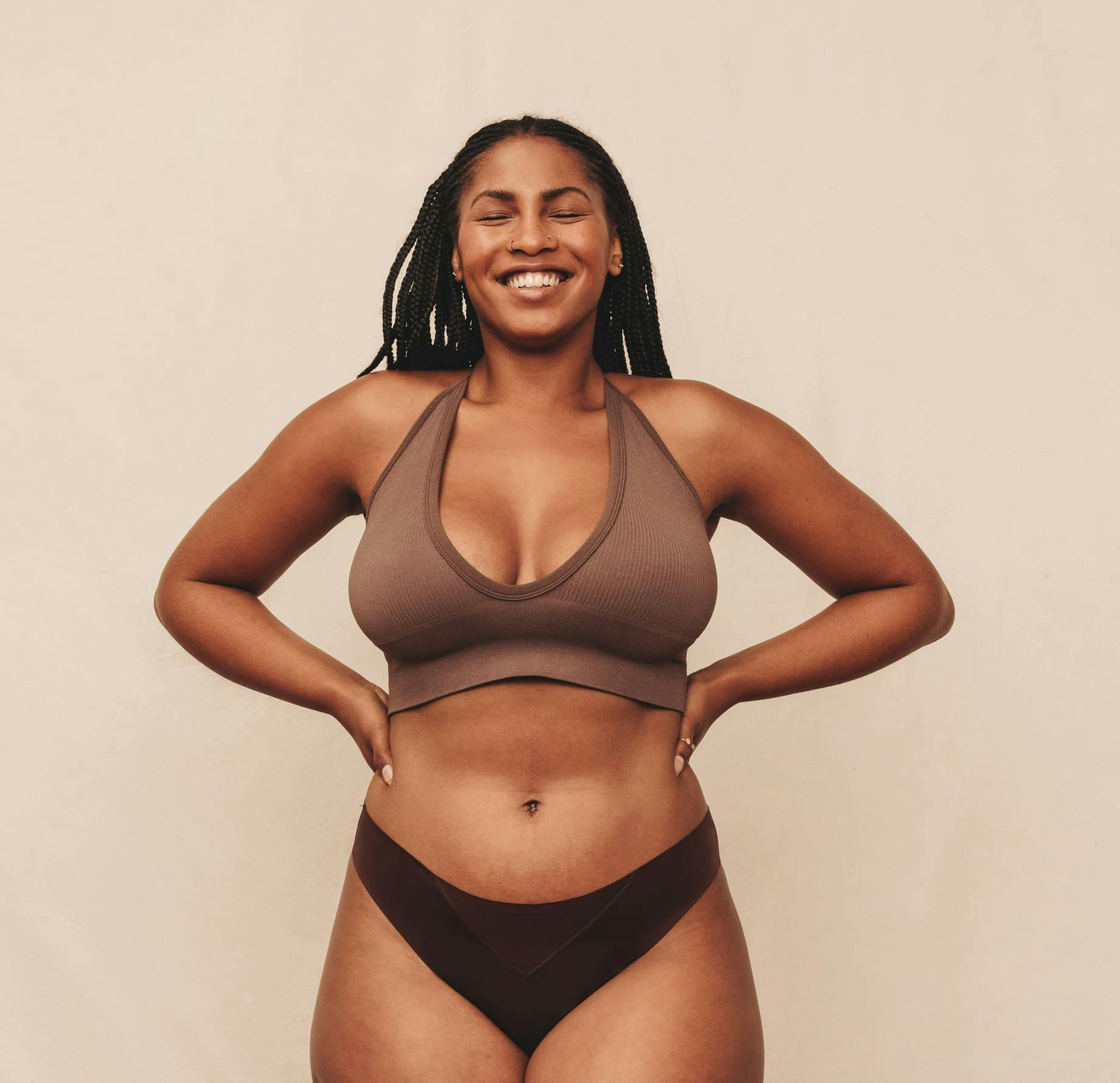 Woman standing in underwera smiling