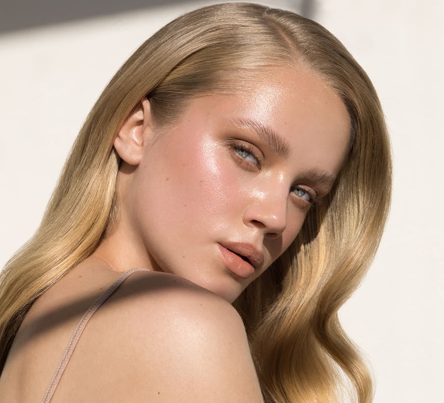 blonde woman looking over her shoulder