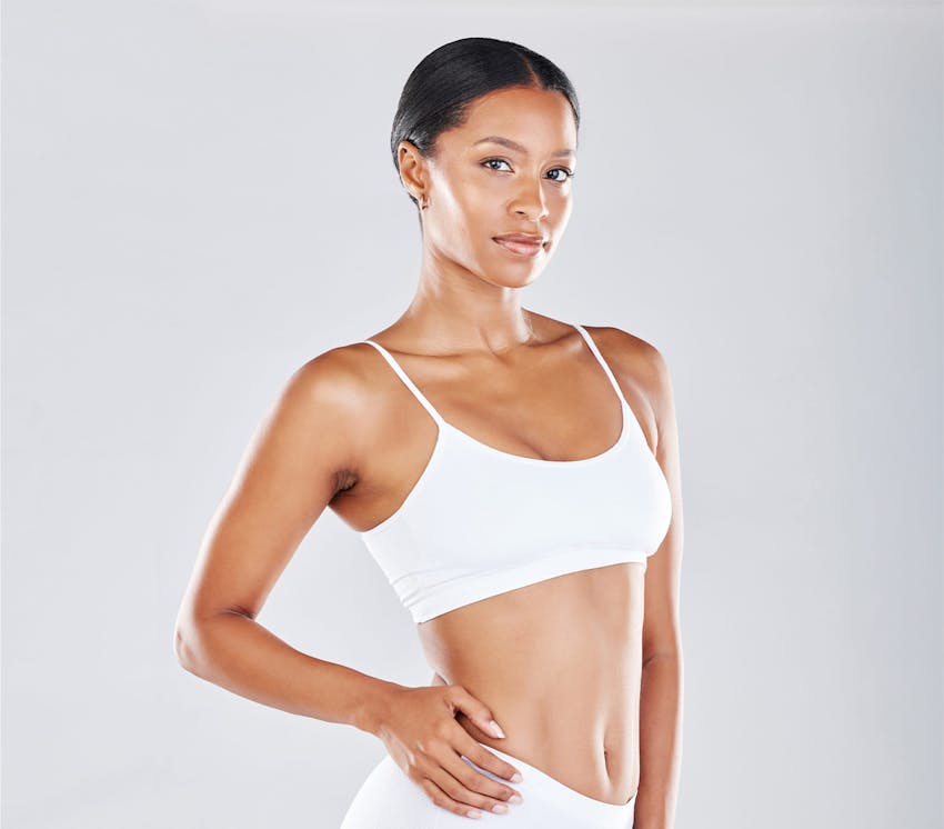 woman's arms touching her head