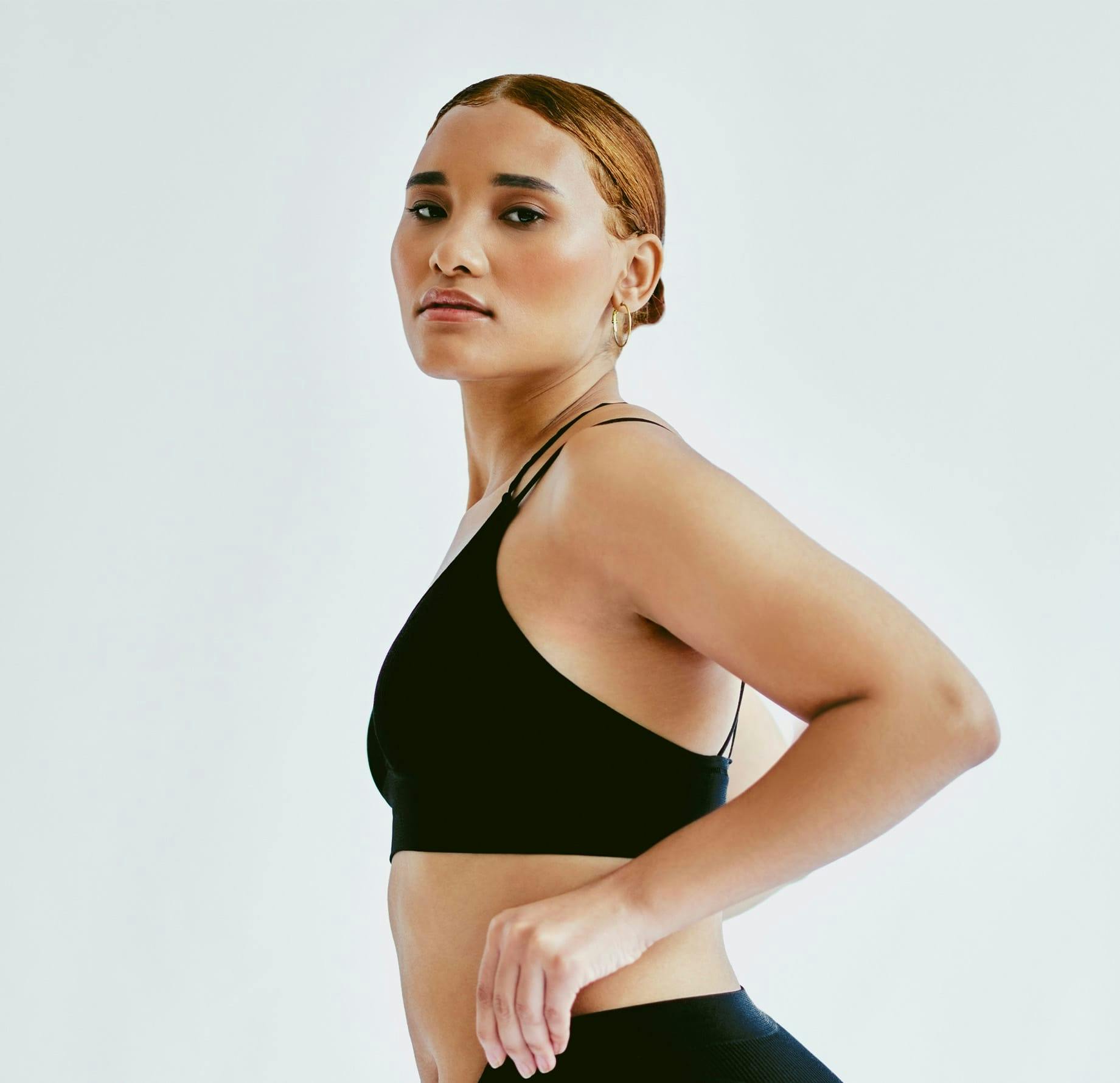 Woman with arms on head