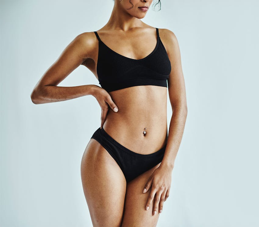 woman laying on floor wearing underwear