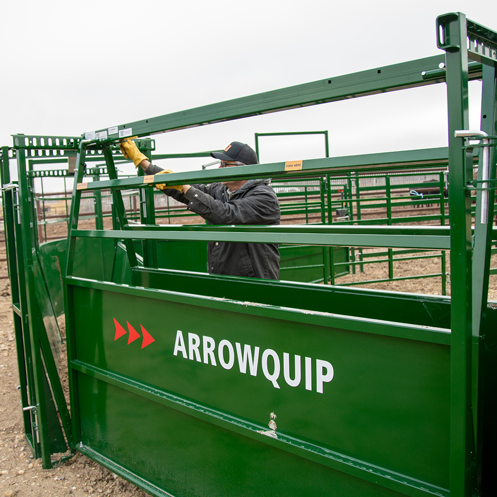 Rancher adjusting the width of Easy Flow Pro Cattle Working Alley