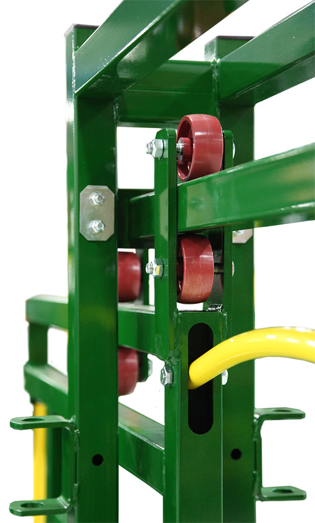 Close up heavy-duty nylon rollers and top-mounted track on Rolling Cattle Alley Gate