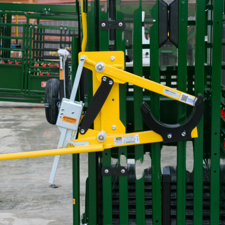 Close-up of cattle head holder installed on chute for securing livestock