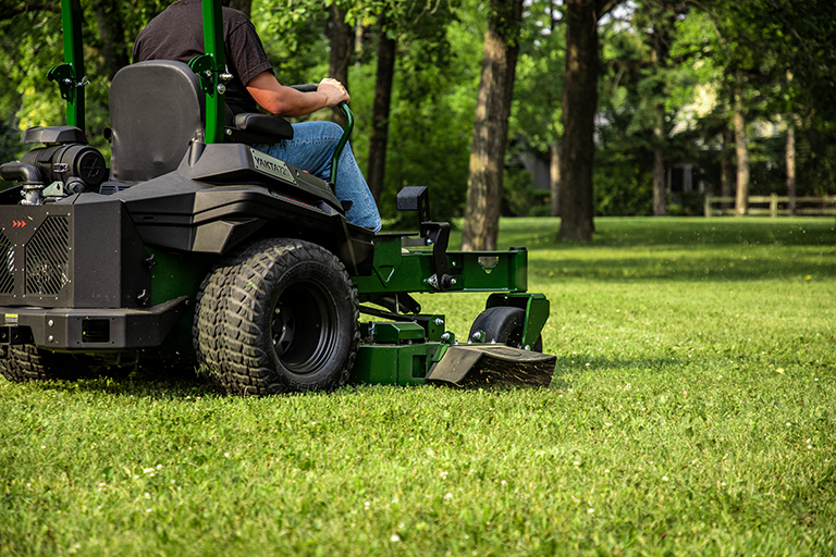 Back view of Arrowquip 720 commercial zero-turn mower showing durable frame and tires