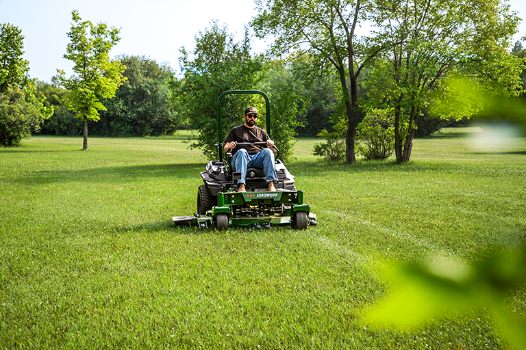Arrowquip 720 commercial zero-turn mower cutting grass with wide deck and clean finish