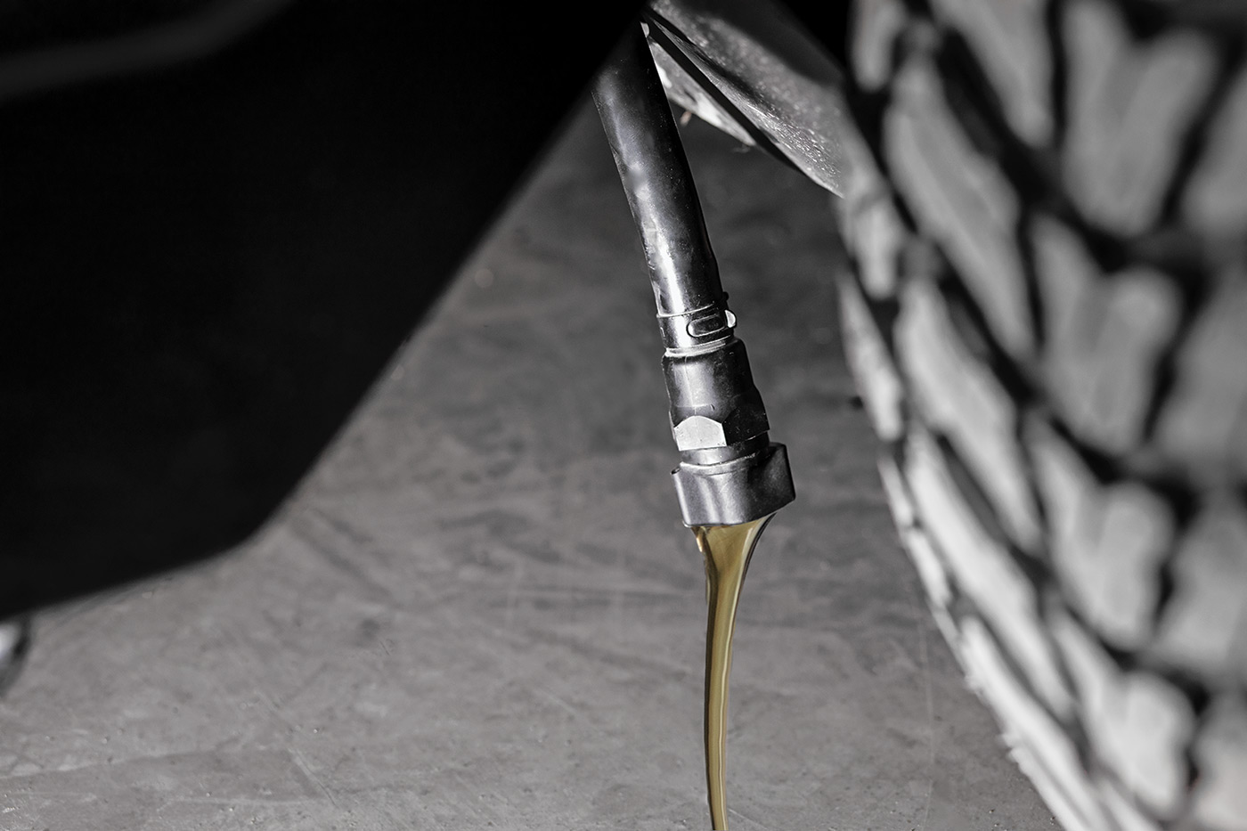 Engine oil being poured during mower maintenance to ensure reliable performance