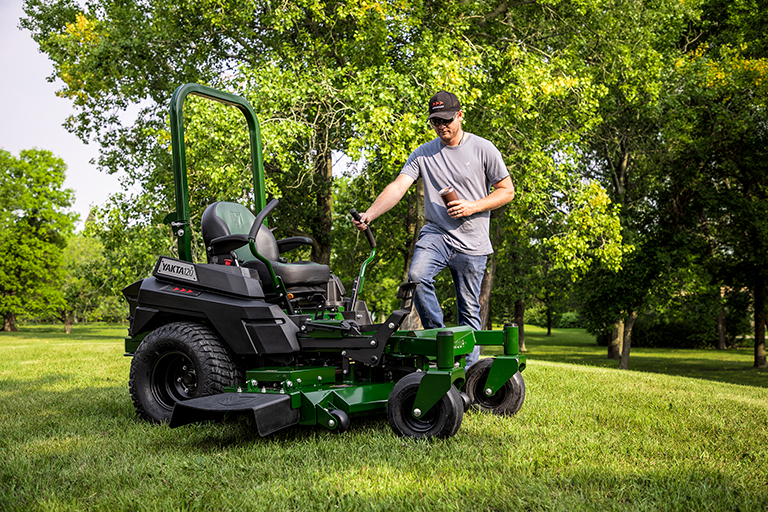 Homeowner stepping onto durable Arrowquip mower deck