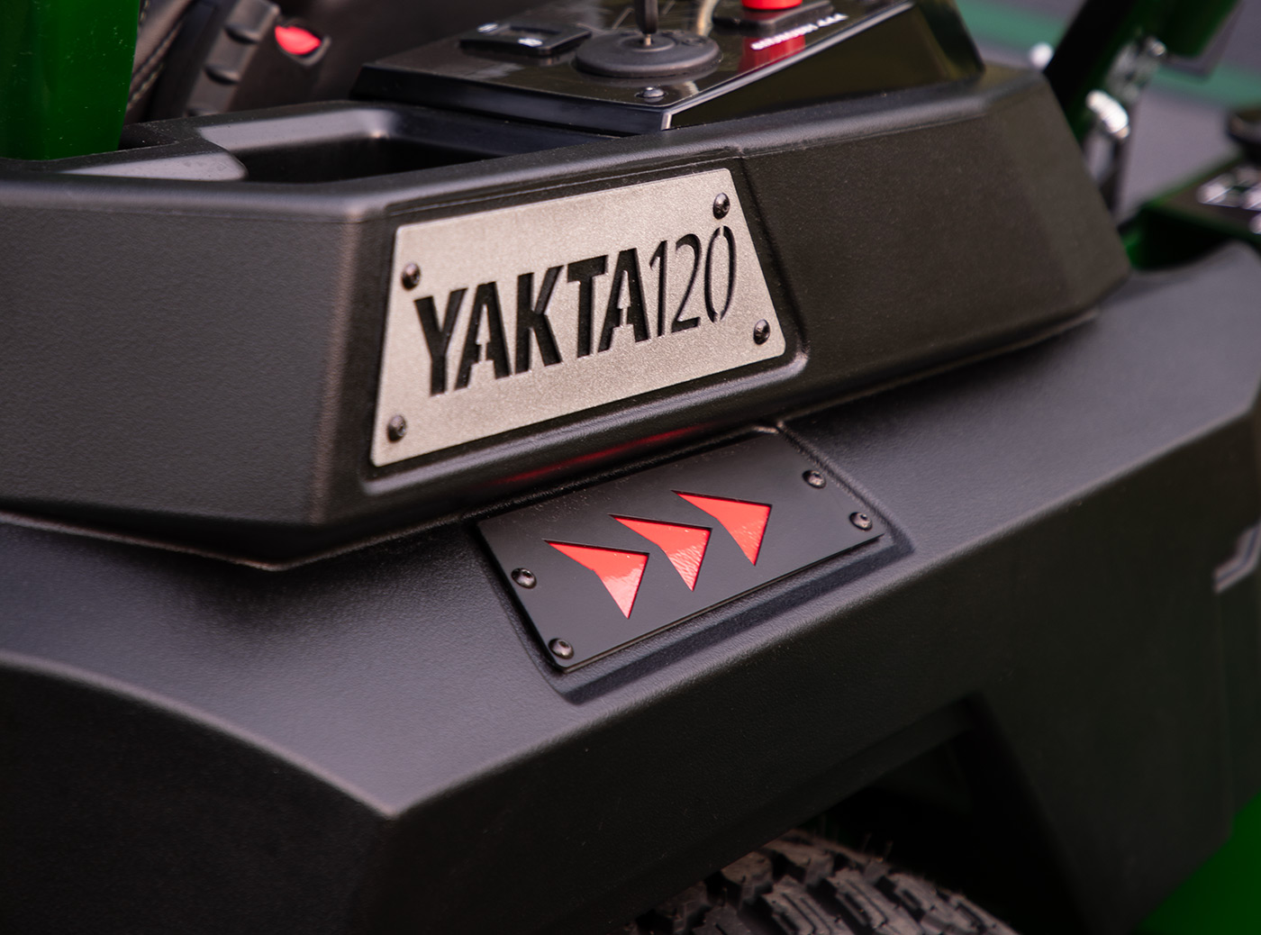 Close-up of Arrowquip Mowers zero-turn mower with Yakta120 badge and durable rear frame design