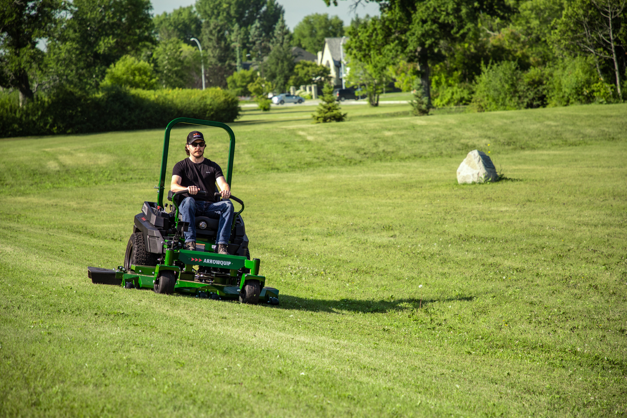 Operator mowing lawn on Yakta zero-turn mower designed for efficiency, smooth handling, and rugged performance