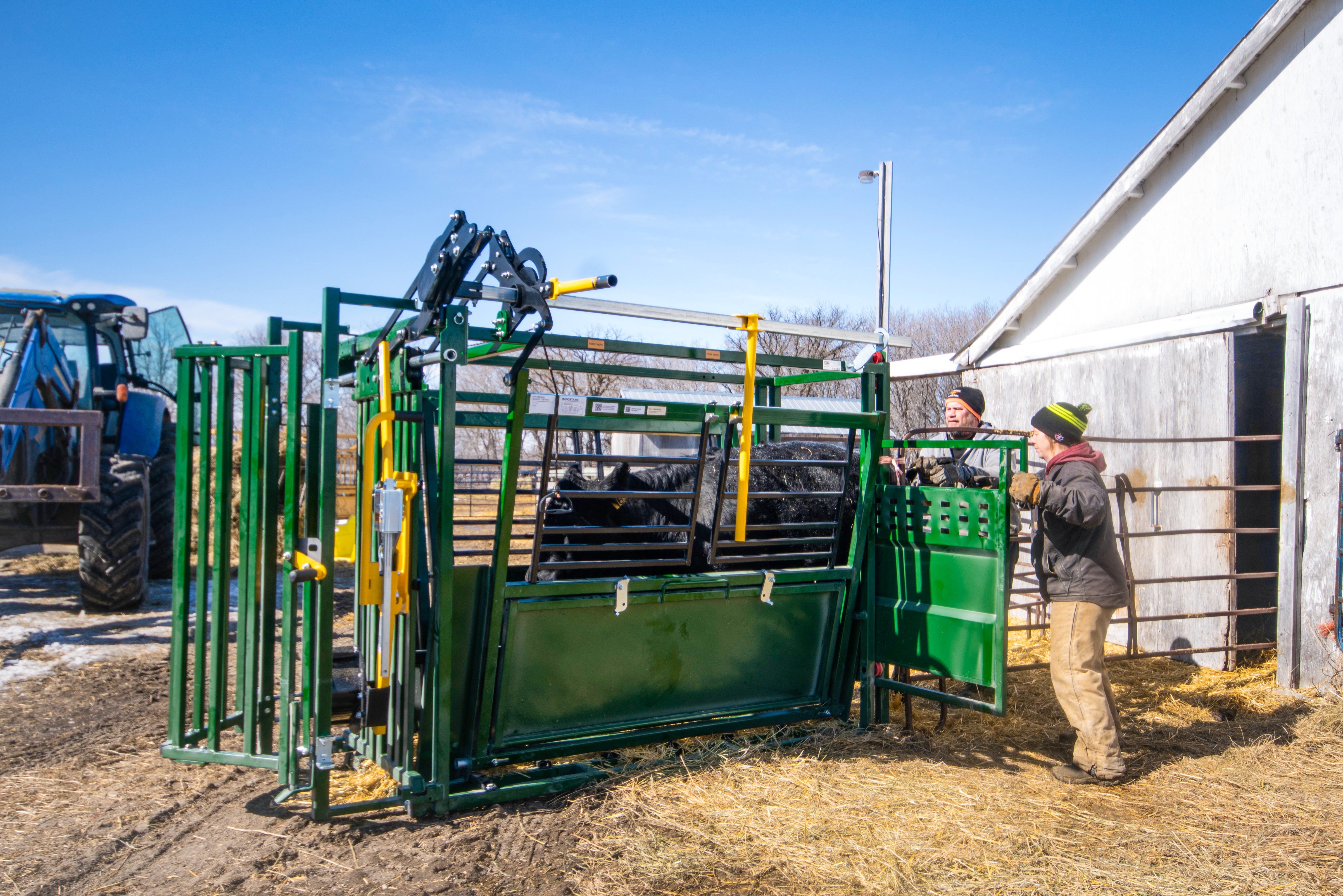 Ranchers opening up rolling alley gate on Easylock 33