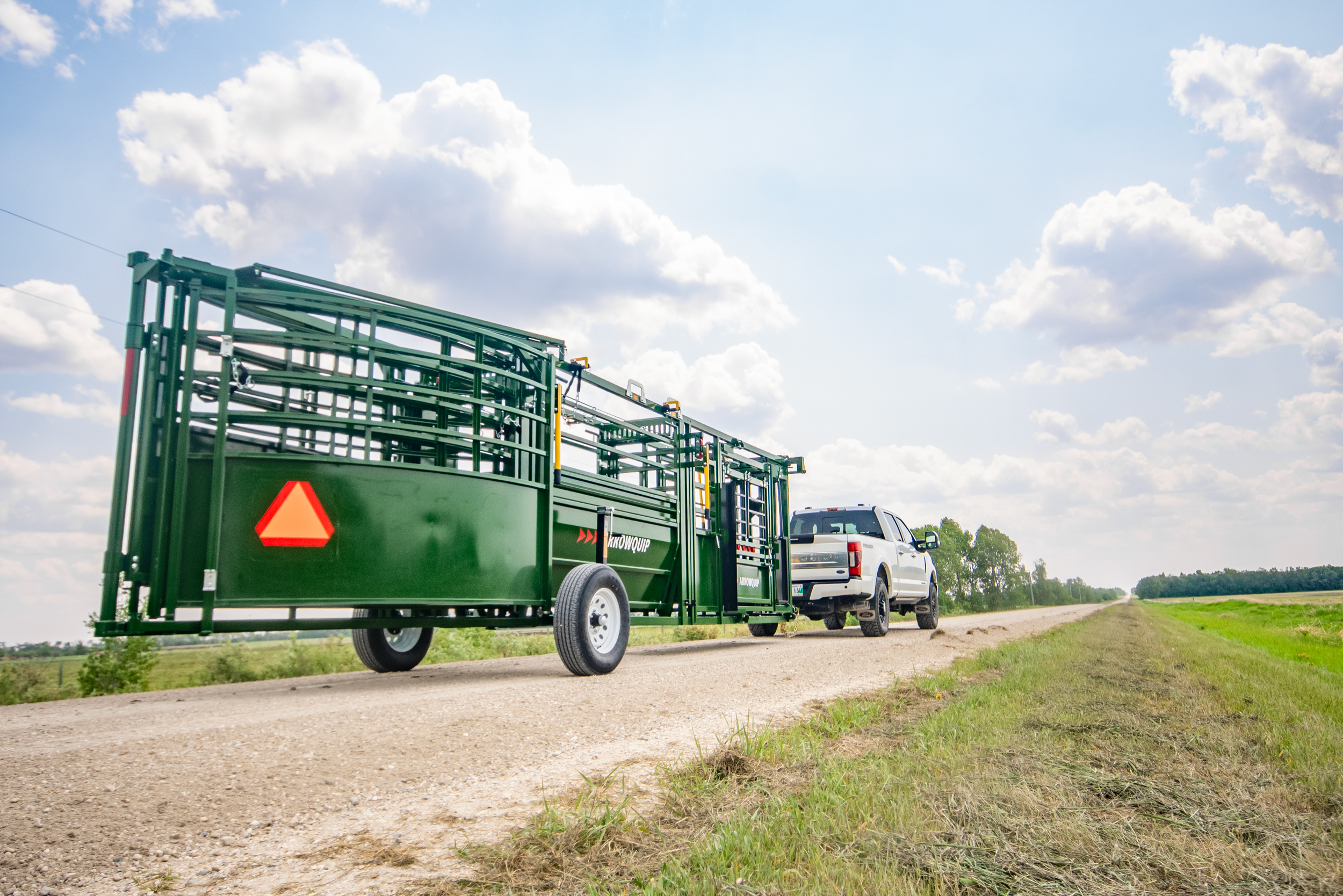 Arrowlock 75 Cattle Chute, Alley and Tub being transported down country road