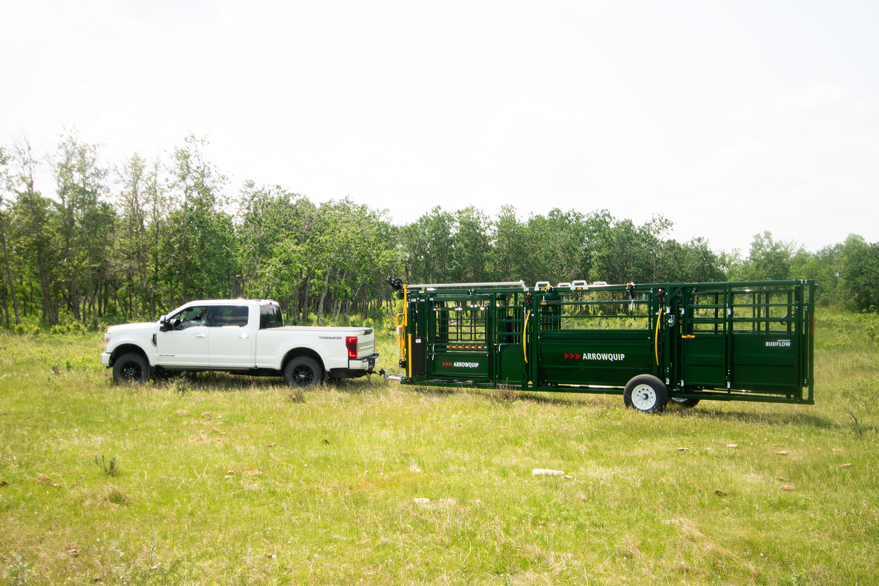 Arowlock 75 Series portable chute, alley and tub being transported through field