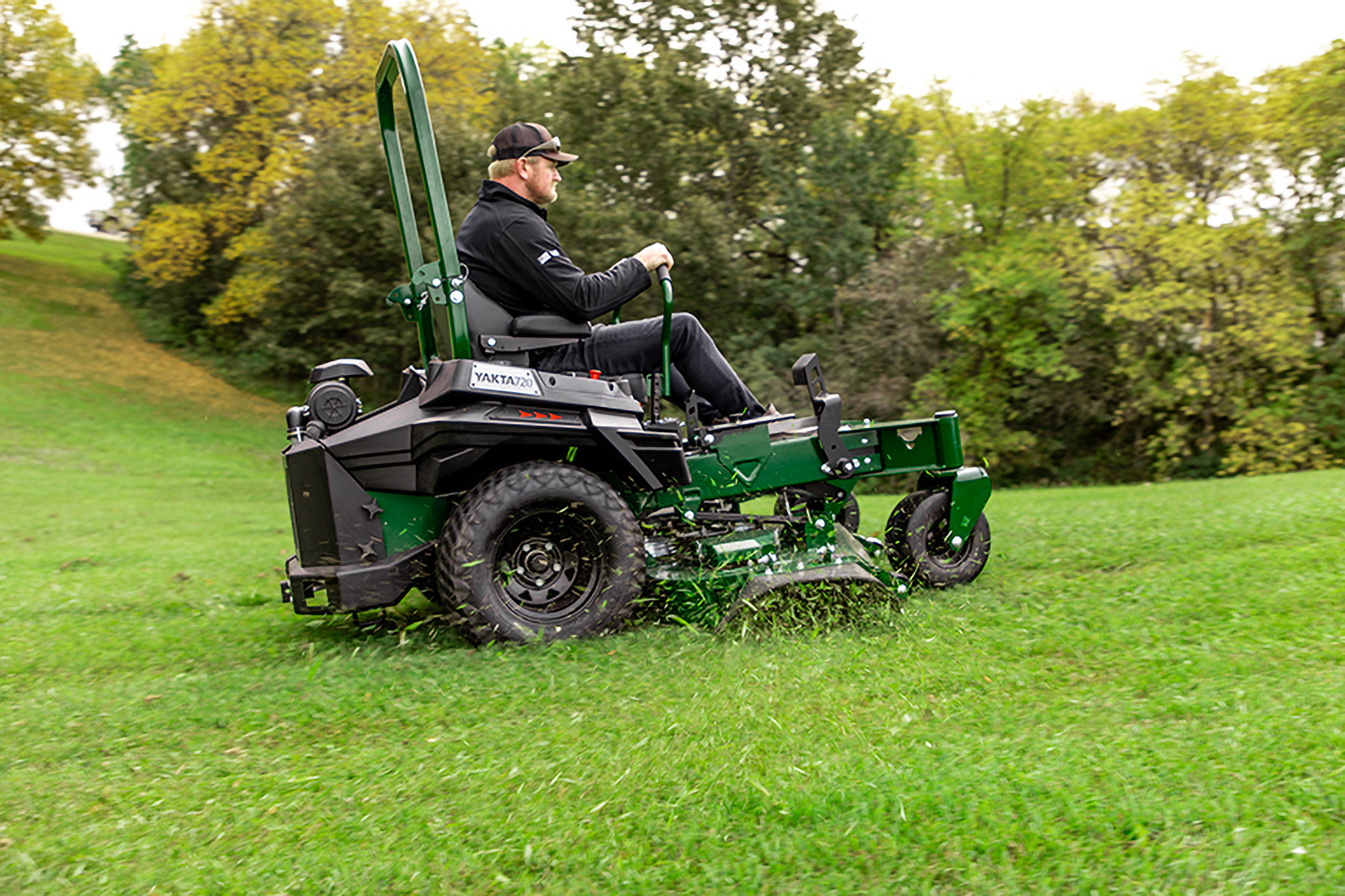 Homeowner mowing grass with Arrowquip mower