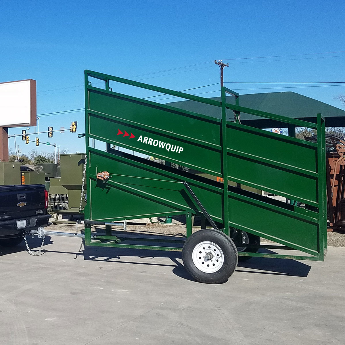 Portable cattle loading chute being towed to a new location