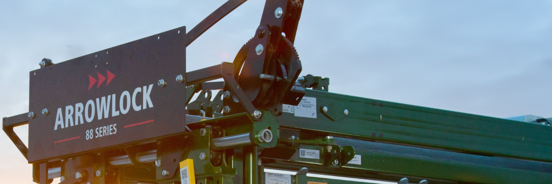 Close up Arrowlock ratchet style head gate on 88 series cattle chute during sunset