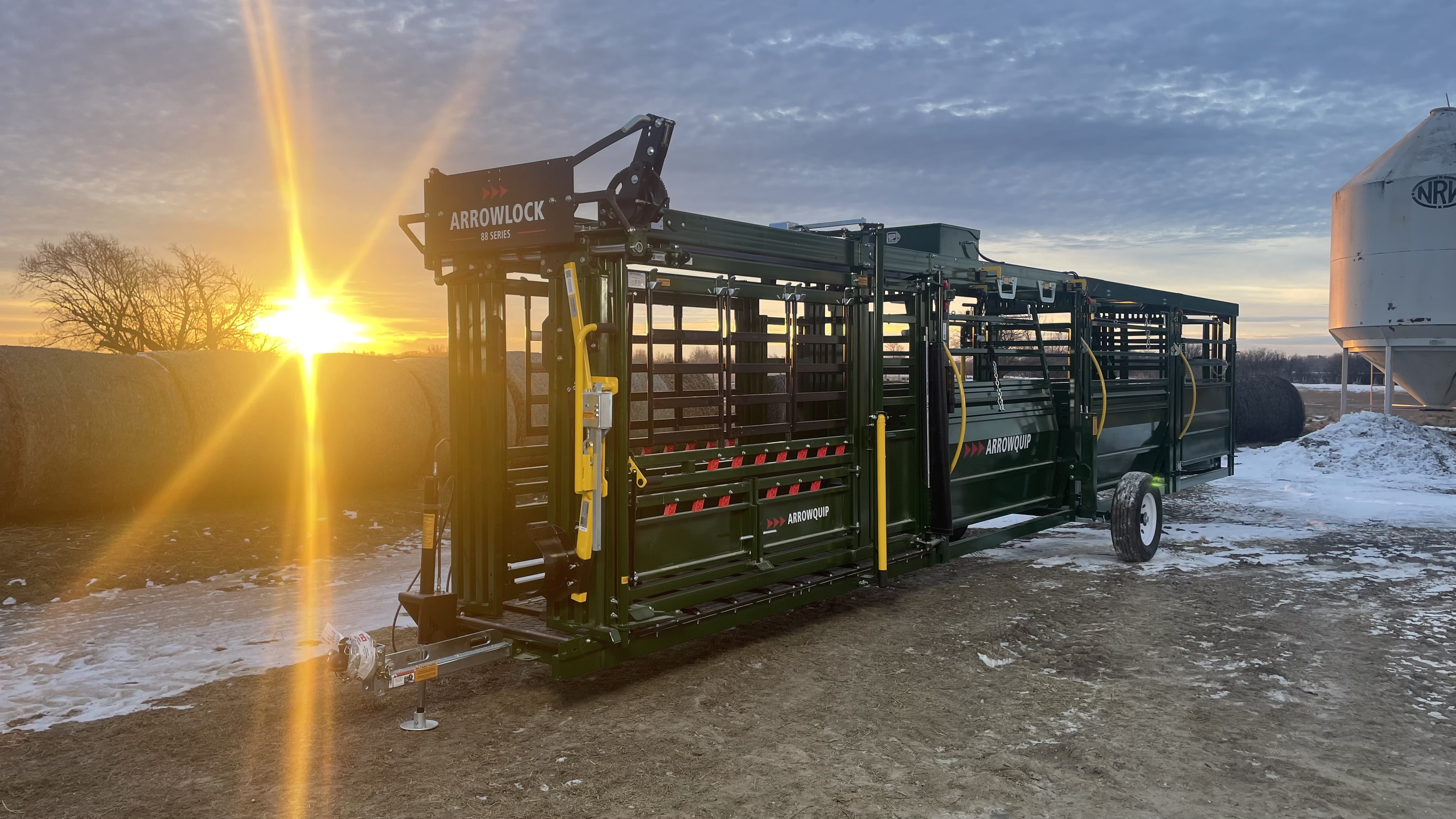 Powerlock 108 series portable chute alley and cattle tub system ready to work in winter at sunset on a ranch