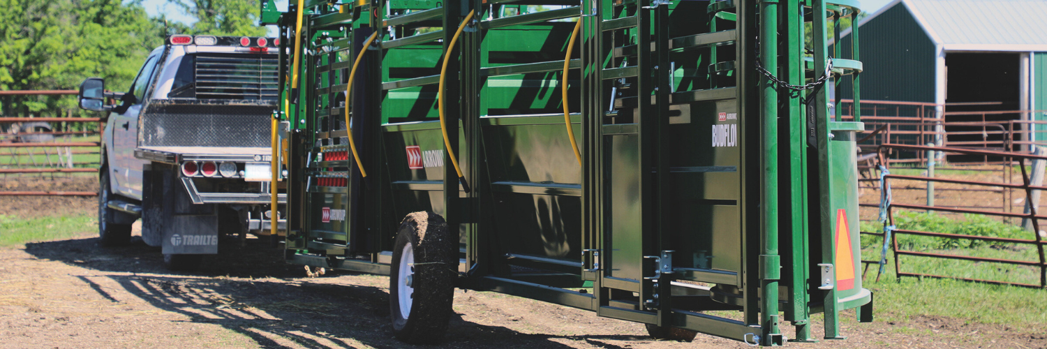 Portable cattle handing unit rear view being towed behind a truck