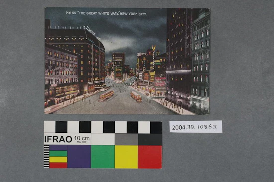 Postcard  with a colour image of a city street at night, including people, high rise buildings and electronic signs, titled "'The Great White Way', New York City"