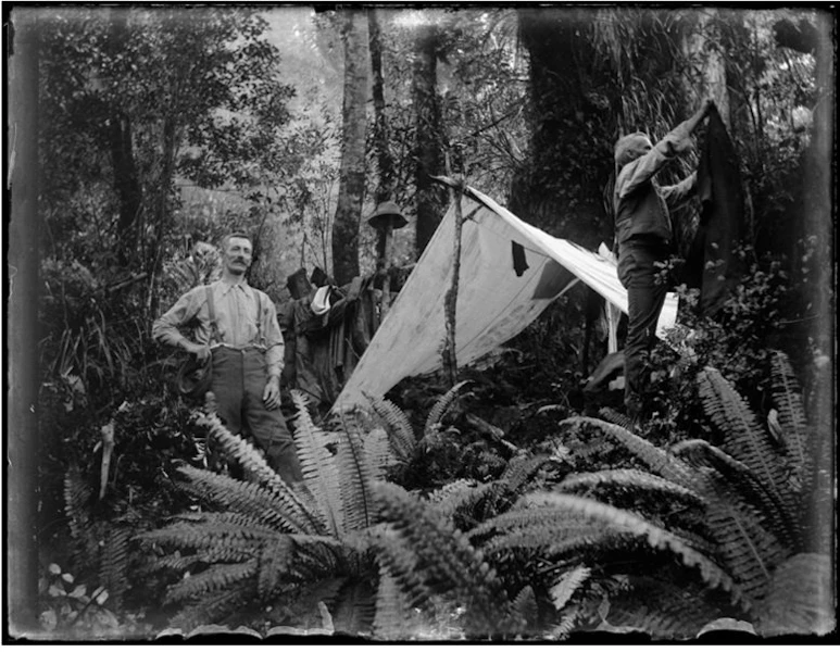 Man outside makeshift tent