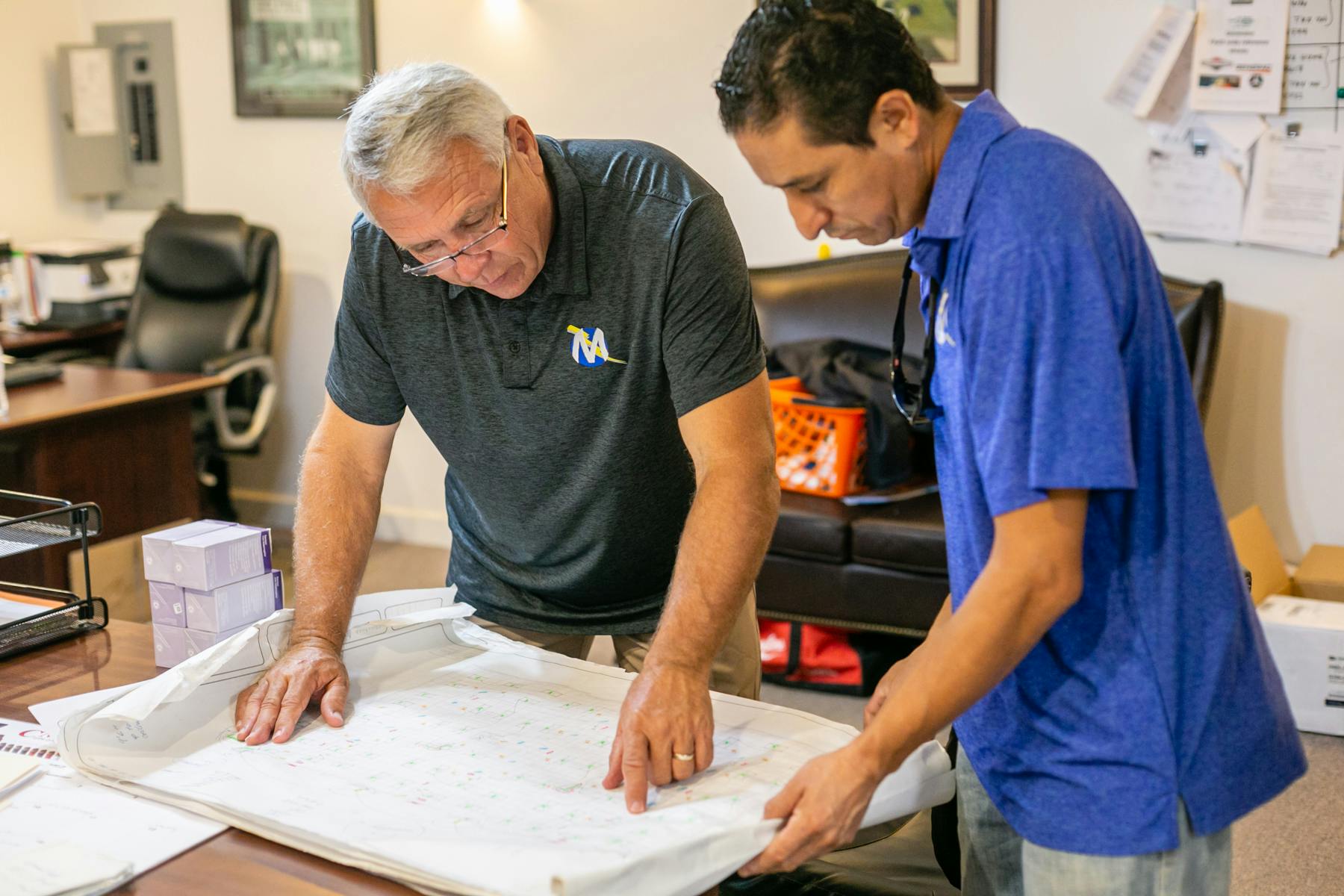 Mabry'c Electrical Inc Team going over plans in the office