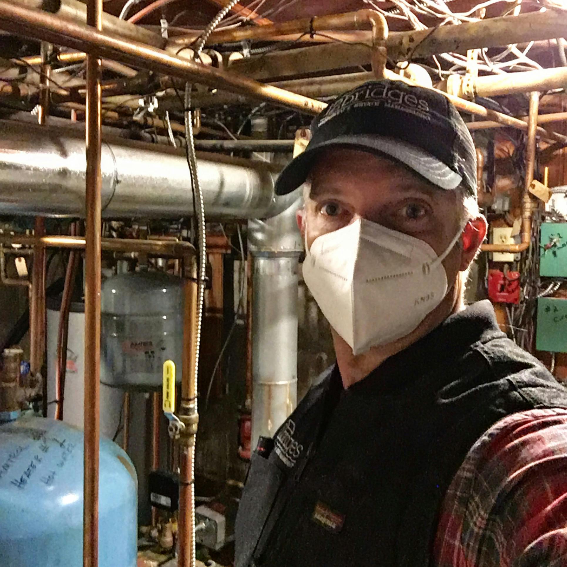 Brad M hard at work in  his clients residence in bucks county. wearing a mask in the basement