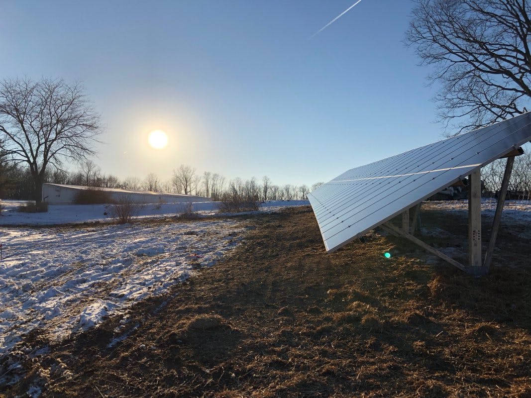 Appalachian Renewable Power Systems industrial solar panel installation with snow and sunrise!