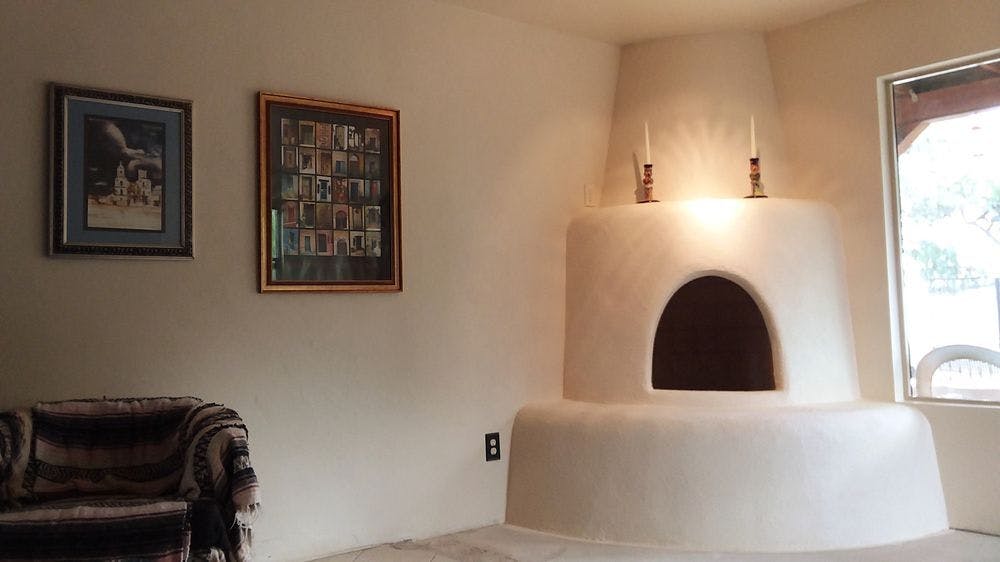 A brand new Kiva (beehive) fireplace built is the newest addition to the home.