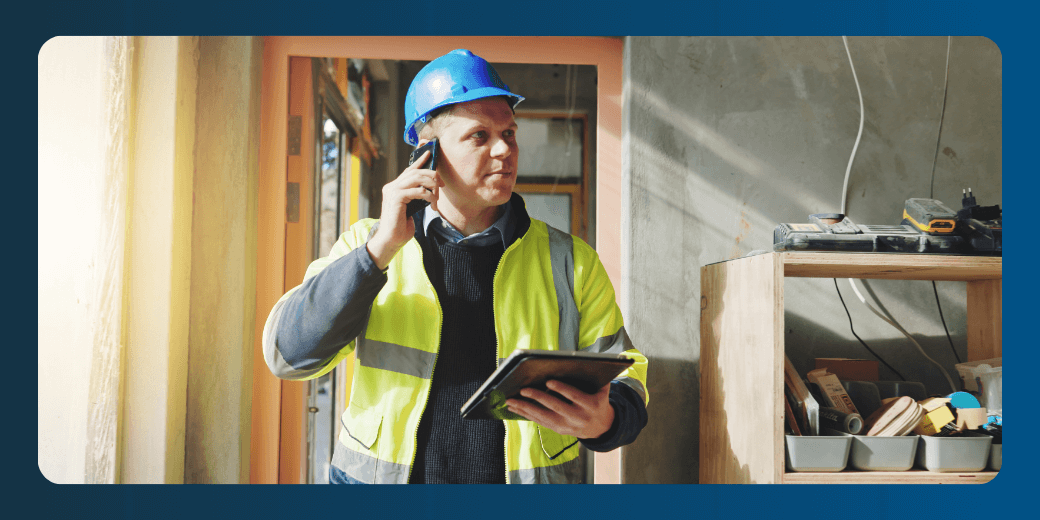 Construction supervisor using a mobile tablet on-site to track field labor and job costs in real time.